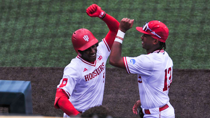 Indiana's Devin Taylor (5) and Indiana's Andrew Wiggins (13) celebrate after Taylor hits a home run during a NCAA Baseball Tournament Knoxville Regional game at Lindsey Nelson Stadium on Sunday, June 2, 2024 in Knoxville, Tenn.