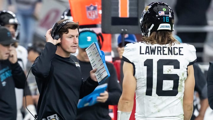 Nov 23, 2025; Glendale, Arizona, USA; Jacksonville Jaguars offensive coordinator Grant Udinski with quarterback Trevor Lawrence (16) against the Arizona Cardinals at State Farm Stadium. Mandatory Credit: Mark J. Rebilas-Imagn Images