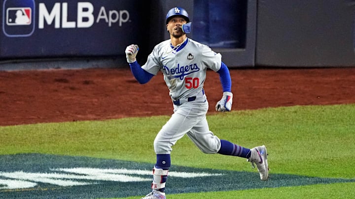 Oct 30, 2024; New York, New York, USA; Los Angeles Dodgers shortstop Mookie Betts (50) celebrates after hitting a sacrifice fly during the eighth inning against the New York Yankees in game four of the 2024 MLB World Series at Yankee Stadium. Mandatory Credit: Brad Penner-Imagn Images