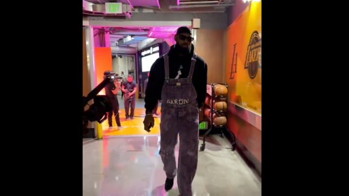 Lakers forward James arrives in custom overalls before a game against the Golden State Warriors