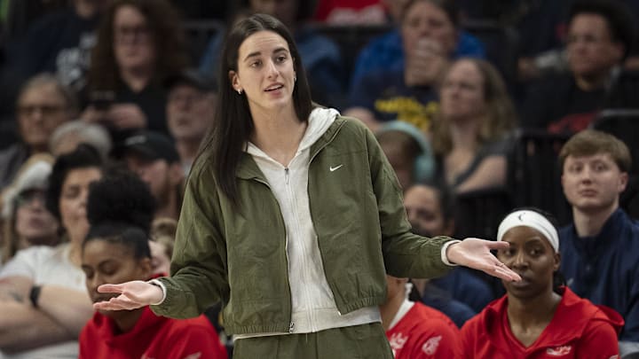 Aug 24, 2025; Minneapolis, Minnesota, USA; Indiana Fever guard Caitlin Clark (22) looks on from the bench against the Minnesota Lynx in the second half at Target Center. Mandatory Credit: Jesse Johnson-Imagn Images