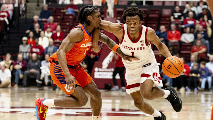 Feb 4, 2026; Stanford, California, USA;  Clemson Tigers guard Jestin Porter (1) defends Stanford Cardinal guard Ebuka Okorie (1) during the first half at Maples Pavilion. Mandatory Credit: John Hefti-Imagn Images