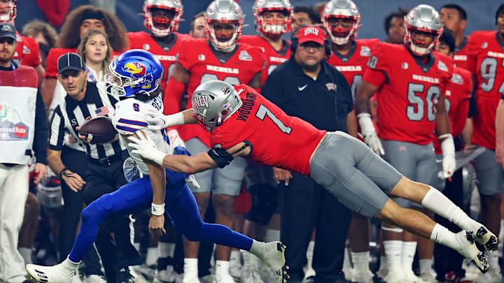 Kansas Jayhawks quarterback Jason Bean (9) runs the ball against UNLV Rebels linebacker Jackson Woodard (7) during the second quarter in the Guaranteed Rate Bowl at Chase Field. Kansas Jayhawks quarterback Jason Bean (9) runs the ball against UNLV Rebels linebacker Jackson Woodard (7) during the second quarter in the Guaranteed Rate Bowl at Chase Field.