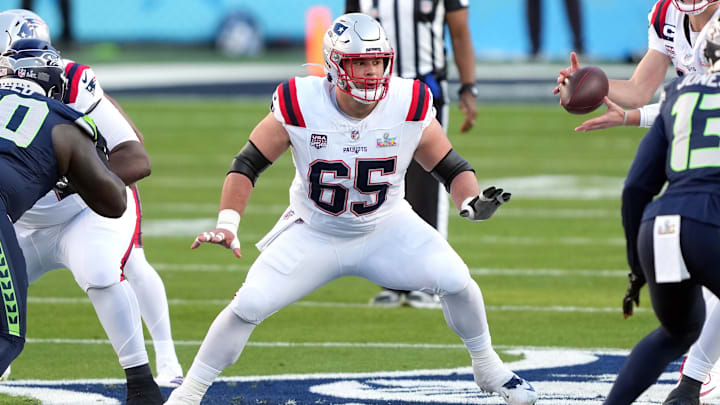 Feb 8, 2026; Santa Clara, CA, USA; New England Patriots center Garrett Bradbury (65) blocks against the Seattle Seahawks during the first quarter in Super Bowl LX at Levi's Stadium. Mandatory Credit: Darren Yamashita-Imagn Images