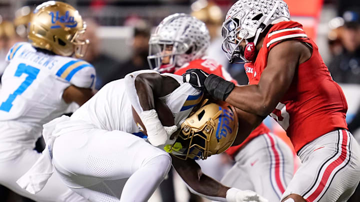 Ohio State Buckeyes linebacker Sonny Styles (0) tackles UCLA Bruins running back Anthony Woods (6) during the NCAA football game at Ohio Stadium in Columbus on Nov. 15, 2025.