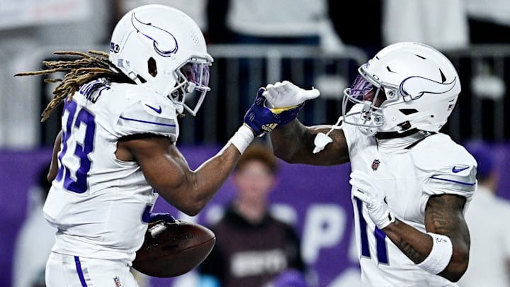 Minnesota Vikings RB Aaron Jones (33) and WR Trent Sherfield (11)