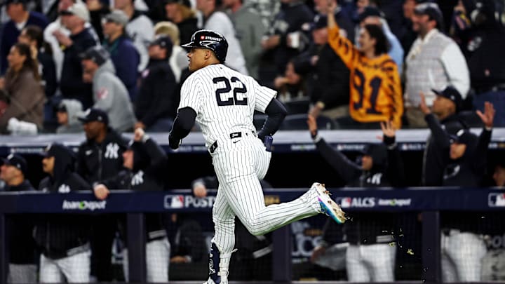 Oct 14, 2024; Bronx, New York, USA; New York Yankees outfielder Juan Soto (22) hits a solo home run during the third inning against the Cleveland Guardians in game one of the ALCS for the 2024 MLB Playoffs at Yankee Stadium.