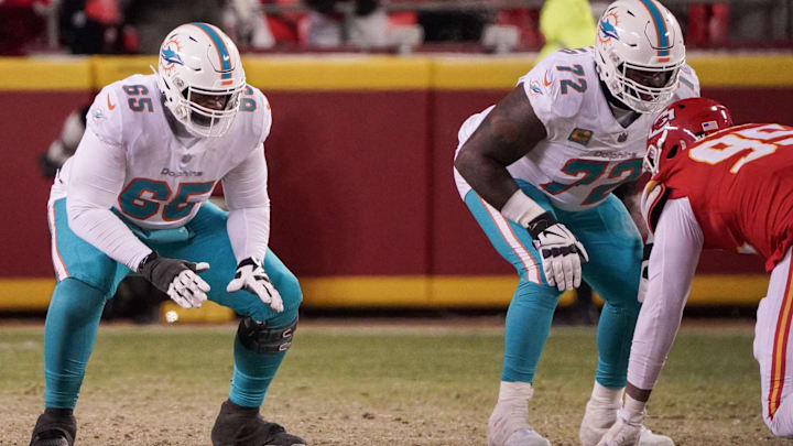 Miami Dolphins guard Robert Jones (65) and offensive tackle Terron Armstead (72) at the line of scrimmage against the Kansas City Chiefs in the AFC wild card game at GEHA Field at Arrowhead Stadium.