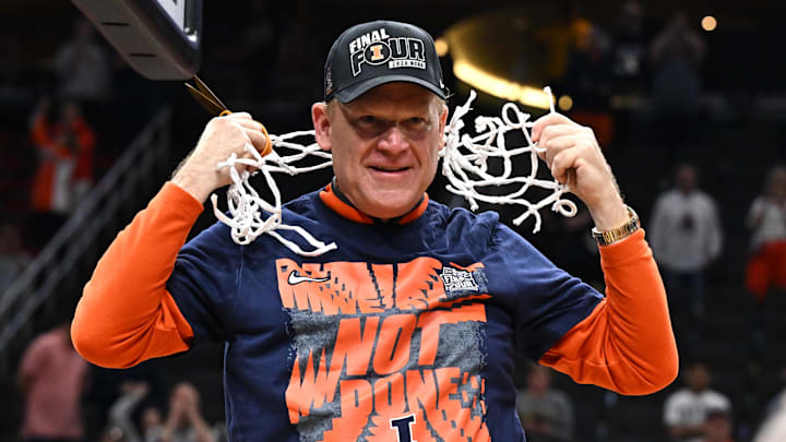 Mar 28, 2026; Houston, TX, USA; Illinois Fighting Illini head coach Brad Underwood celebrates after cutting down the net after defeating the Iowa Hawkeyes in an Elite Eight game of the South Regional of the men's 2026 NCAA Tournament at Toyota Center. Mandatory Credit: Maria Lysaker-Imagn Images