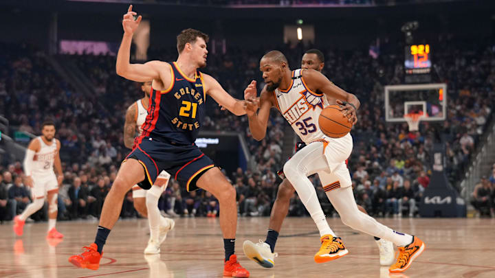 Jan 31, 2025; San Francisco, California, USA; Phoenix Suns forward Kevin Durant (35) dribbles next to Golden State Warriors center Quinten Post (21) in the first quarter at the Chase Center. Mandatory Credit: Cary Edmondson-Imagn Images