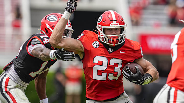 Apr 18, 2026; Athens, GA, USA; Georgia Bulldogs tight end Jaden Reddell (23) runs against defensive back Radeon Dinkins (17) during the Georgia Spring football game at Sanford Stadium. Mandatory Credit: Dale Zanine-Imagn Images