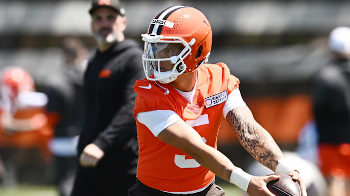 May 9, 2025; Berea, OH, USA; Cleveland Browns head coach Kevin Stefanski watches quarterback Dillon Gabriel (5) run a drill during rookie minicamp at CrossCountry Mortgage Campus. Mandatory Credit: Ken Blaze-Imagn Images