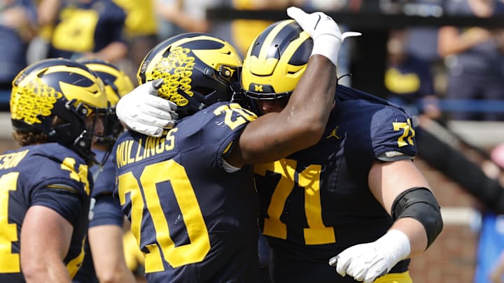Sep 14, 2024; Ann Arbor, Michigan, USA; Michigan Wolverines running back Kalel Mullings (20) celebrates with offensive lineman Evan Link (71) after running for a touchdown against the Arkansas State Red Wolves in first half at Michigan Stadium. Sep 14, 2024; Ann Arbor, Michigan, USA; Michigan Wolverines running back Kalel Mullings (20) celebrates with offensive lineman Evan Link (71) after running for a touchdown against the Arkansas State Red Wolves in first half at Michigan Stadium.