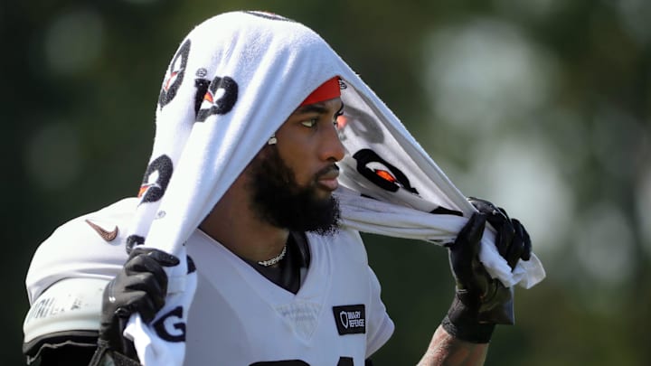Cleveland Browns cornerback Denzel Ward (21) watches practice from the sideline during NFL training camp at CrossCountry Mortgage Campus, Wednesday, July 30, 2025, in Berea, Ohio.