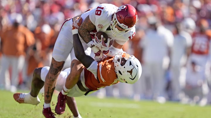 Oklahoma Sooners tight end Kaden Helms (18) looks to get by Texas Longhorns defensive back Jelani McDonald (4)