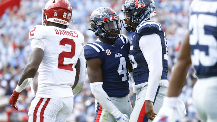 Oct 26, 2024; Oxford, Mississippi, USA; Mississippi Rebels defensive end Jared Ivey (15) reacts with Mississippi Rebels linebacker Suntarine Perkins (4) after a sack during the first half against the Oklahoma Sooners at Vaught-Hemingway Stadium. Mandatory Credit: Petre Thomas-Imagn Images