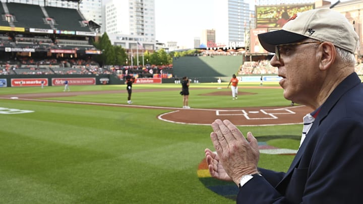 Baltimore Orioles owner David Rubenstein  claps while walking on the field before the game against the Texas Rangers  at Oriole Park at Camden Yards. 