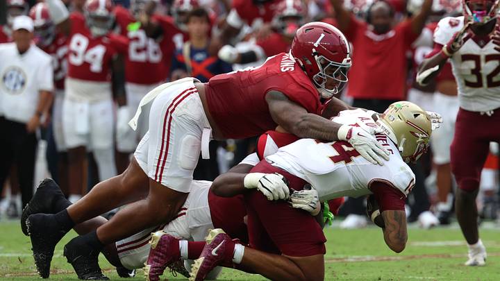 Sep 19, 2026; Tuscaloosa, Alabama, USA; Alabama Crimson Tide defensive line Devan Thompkins (1) and defensive line Terrance Green (99) sack Florida State Seminoles quarterback Ashton Daniels (14) during the first half at Saban Field at Bryant-Denny Stadium. Sep 19, 2026; Tuscaloosa, Alabama, USA; Alabama Crimson Tide defensive line Devan Thompkins (1) and defensive line Terrance Green (99) sack Florida State Seminoles quarterback Ashton Daniels (14) during the first half at Saban Field at Bryant-Denny Stadium.