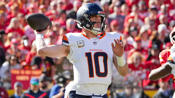 Nov 10, 2024; Kansas City, Missouri, USA; Denver Broncos quarterback Bo Nix (10) throws a pass against the Kansas City Chiefs during the first half at GEHA Field at Arrowhead Stadium. 