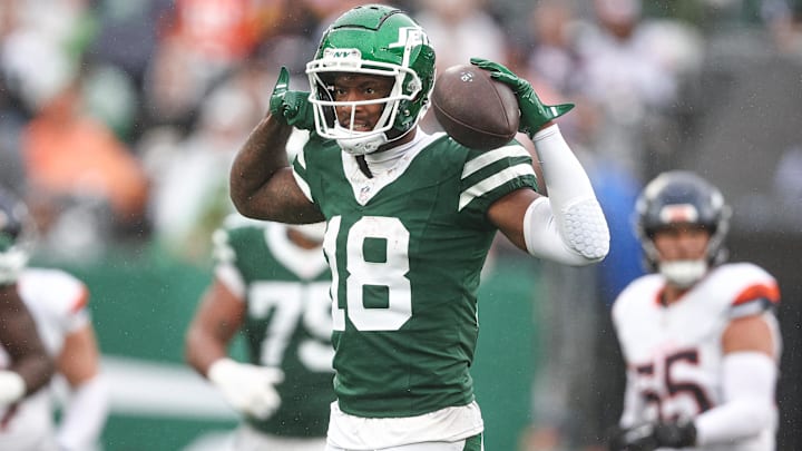 Sep 29, 2024; East Rutherford, New Jersey, USA; New York Jets wide receiver Mike Williams (18) celebrates a first down reception during the second half against the Denver Broncos at MetLife Stadium. Mandatory Credit: Vincent Carchietta-Imagn Images
