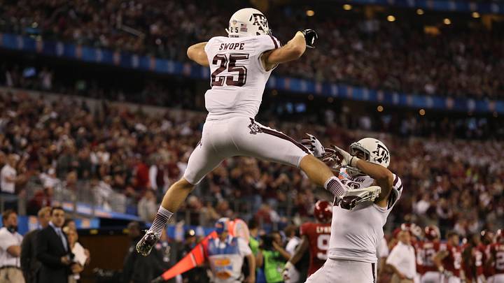 Texas A&M Aggies receiver Ryan Swope (25) celebrates a third-quarter touchdown with receiver Mike Evans (13) against the Oklahoma Sooners during the 2013 Cotton Bowl at Cowboys Stadium. 