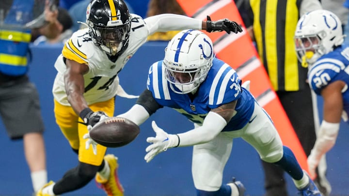 Indianapolis Colts safety Julian Blackmon (32) recovers a ball fumbled by Pittsburgh Steelers wide receiver George Pickens (14) on Sunday, Sept. 29, 2024, during a game against the Pittsburgh Steelers at Lucas Oil Stadium in Indianapolis.
