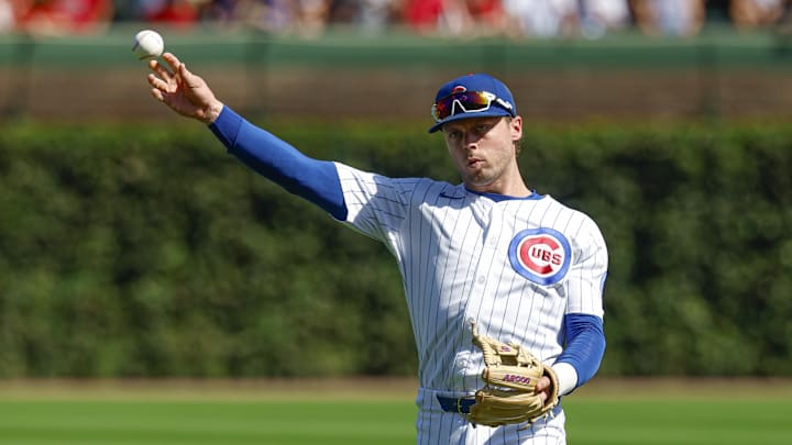 Sep 27, 2025; Chicago, Illinois, USA; Chicago Cubs second baseman Nico Hoerner (2) warms up before a baseball game against the St. Louis Cardinals at Wrigley Field. Mandatory Credit: Kamil Krzaczynski-Imagn Images