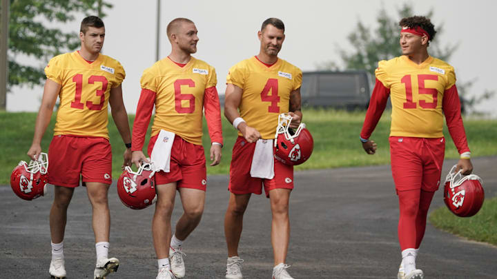 Jul 27, 2022; St. Joseph, MO, USA; Kansas City Chiefs quarterback Dustin Crum (13) and quarterback Bryan Cook (6) and quarterback Chad Henne (4) and quarterback Patrick Mahomes (15) walk down to the field during training camp at Missouri Western State University. Mandatory Credit: Denny Medley-USA TODAY Sports