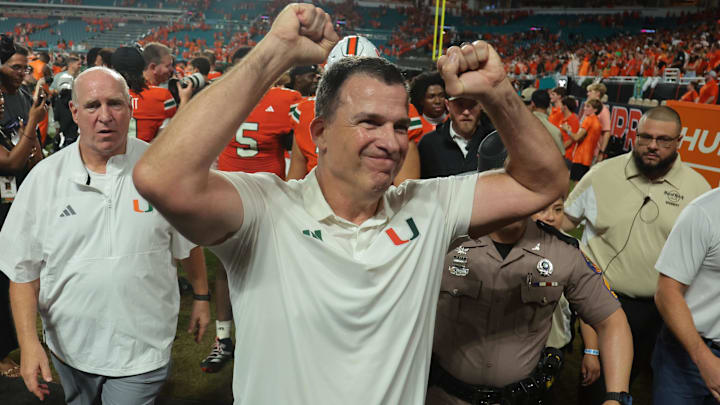 Aug 31, 2025; Miami Gardens, Florida, USA; Miami Hurricanes head coach Mario Cristobal reacts after defeating the Notre Dame Fighting Irish at Hard Rock Stadium. Mandatory Credit: Sam Navarro-Imagn Images