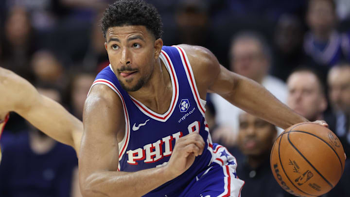 Feb 19, 2026; Philadelphia, Pennsylvania, USA; Philadelphia 76ers guard Quentin Grimes (5) drives against the Atlanta Hawks during the fourth quarter at Xfinity Mobile Arena. 