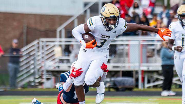 Detroit Country Day's Anthony Cartwright rushes during a football game on Saturday, Sept. 6, 2025, at Joseph P. Healey Field.