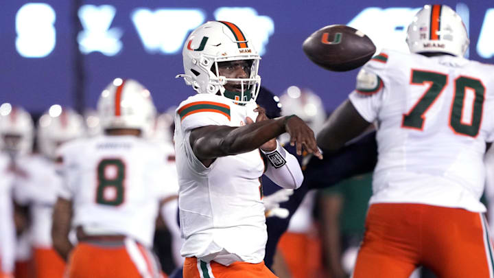 Oct 5, 2024; Berkeley, California, USA; Miami Hurricanes quarterback Cam Ward (1) throws a pass against the California Golden Bears during the first quarter at California Memorial Stadium. Mandatory Credit: Darren Yamashita-Imagn Images