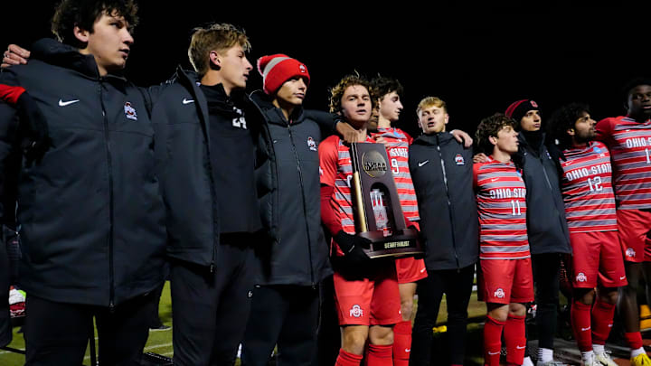 Ohio State midfielder Parker Grinstead (10) holds the trophy as they celebrate their victory over the Wake Forest Demon Deacons in the NCAA Tournament quarterfinal match at Jesse Owens Memorial Stadium on Saturday, Dec. 7, 2024 in Columbus, Ohio. Ohio State midfielder Parker Grinstead (10) holds the trophy as they celebrate their victory over the Wake Forest Demon Deacons in the NCAA Tournament quarterfinal match at Jesse Owens Memorial Stadium on Saturday, Dec. 7, 2024 in Columbus, Ohio.