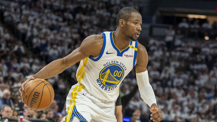 May 8, 2025; Minneapolis, Minnesota, USA; Golden State Warriors forward Jonathan Kuminga (00) dribbles the ball against the Minnesota Timberwolves in the second half during game two of the second round for the 2025 NBA Playoffs at Target Center. Mandatory Credit: Jesse Johnson-Imagn Images