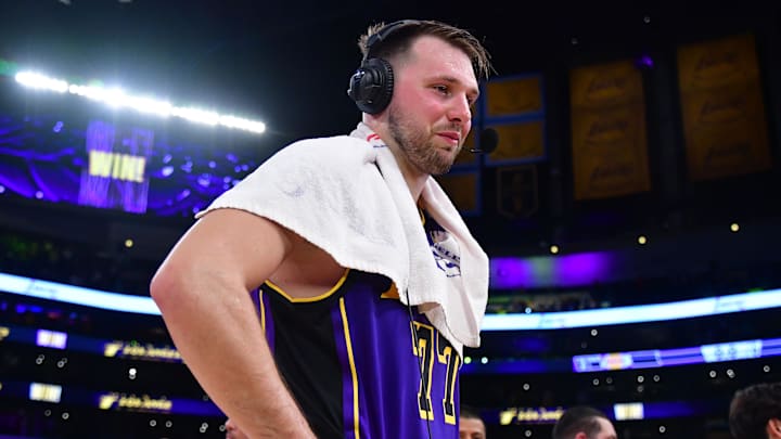 Feb 25, 2025; Los Angeles, California, USA; Los Angeles Lakers guard Luka Doncic (77) speaks to the media after the game against the Dallas Mavericks reacts at Crypto.com Arena. Mandatory Credit: Gary A. Vasquez-Imagn Images