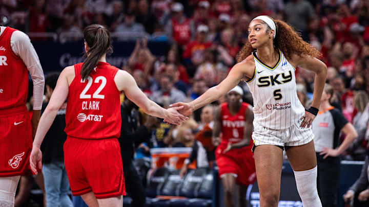 May 17, 2025; Indianapolis, Indiana, USA; Indiana Fever guard Caitlin Clark (22) and Chicago Sky forward Angel Reese (5) shake hands before the game at Gainbridge Fieldhouse. Mandatory Credit: Trevor Ruszkowski-Imagn Images