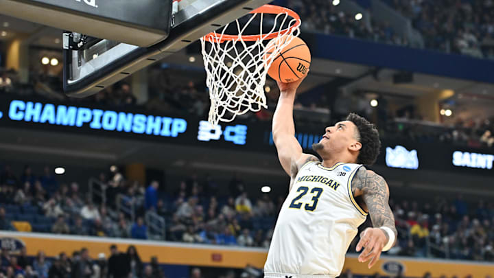 Mar 21, 2026; Buffalo, NY, USA; Michigan Wolverines forward Yaxel Lendeborg (23) dunks the ball in the second half against the Saint Louis Billikens during a second round game of the men's 2026 NCAA Tournament at Keybank Center.