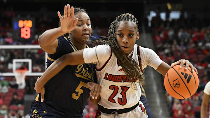 Mar 1, 2026; Louisville, Kentucky, USA; Louisville Cardinals guard Skylar Jones (23) dribbles against Notre Dame Fighting Irish forward Malaya Cowles (5) during the first half at KFC Yum! Center. Mandatory Credit: Jamie Rhodes-Imagn Images Mar 1, 2026; Louisville, Kentucky, USA; Louisville Cardinals guard Skylar Jones (23) dribbles against Notre Dame Fighting Irish forward Malaya Cowles (5) during the first half at KFC Yum! Center. Mandatory Credit: Jamie Rhodes-Imagn Images