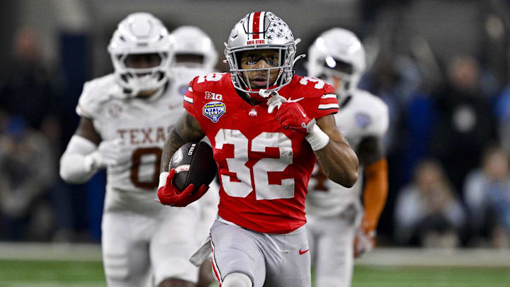 Jan 10, 2025; Arlington, TX, USA;  Ohio State Buckeyes running back TreVeyon Henderson (32) scores a touchdown on a pass from quarterback Will Howard (not pictured) during the second quarter at AT&T Stadium. Mandatory Credit: Jerome Miron-Imagn Images