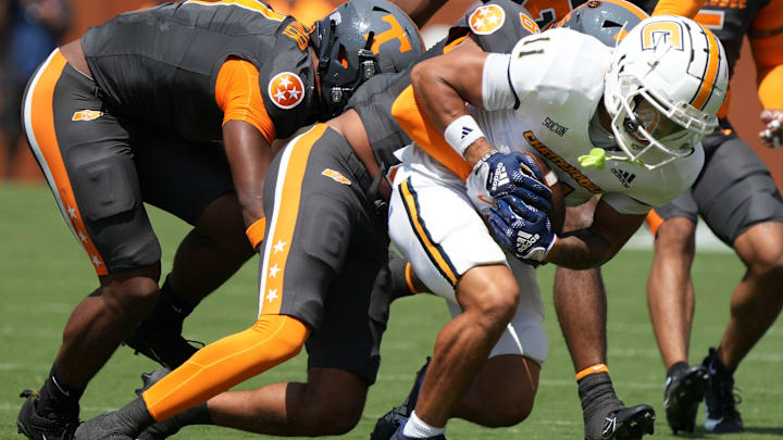 Chattanooga wide receiver Sam Phillips (11) is tackled during a game between Tennessee and Chattanooga, Saturday, Aug. 31, 2024. Chattanooga wide receiver Sam Phillips (11) is tackled during a game between Tennessee and Chattanooga, Saturday, Aug. 31, 2024.