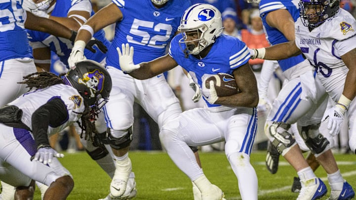 Oct 28, 2022; Provo, Utah, USA; BYU Cougars running back Miles Davis (19) runs during the second quarter against the East Carolina Pirates at LaVell Edwards Stadium. Mandatory Credit: Christopher Creveling-Imagn Images