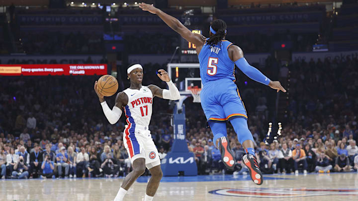 Apr 2, 2025; Oklahoma City, Oklahoma, USA; Oklahoma City Thunder guard Luguentz Dort (5) leaps to block a pass by Detroit Pistons guard Dennis Schroder (17) during the first quarter at Paycom Center. Mandatory Credit: Alonzo Adams-Imagn Images Apr 2, 2025; Oklahoma City, Oklahoma, USA; Oklahoma City Thunder guard Luguentz Dort (5) leaps to block a pass by Detroit Pistons guard Dennis Schroder (17) during the first quarter at Paycom Center. Mandatory Credit: Alonzo Adams-Imagn Images