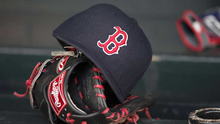 May 14, 2014; Minneapolis, MN, USA; A general view of a glove and Boston Red Sox hat in the dugout prior to a game between the Boston Red Sox and Minnesota Twins at Target Field. Mandatory Credit: Jesse Johnson-Imagn Images