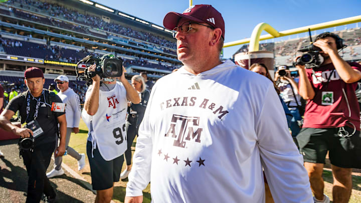 Nov 22, 2025; College Station, Texas, USA; Texas A&M Aggies head coach Mike Elko walks off the field after defeating the Samford Bulldogs 48-0 in a game at Kyle Field. Mandatory Credit: Joseph Buvid-Imagn Images