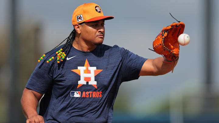Feb 14, 2025; West Palm Beach, FL, USA; Houston Astros starting pitcher Luis Garcia (77) works on a fielding exercise during a spring training workout at CACTI Park of the Palm Beaches. Feb 14, 2025; West Palm Beach, FL, USA; Houston Astros starting pitcher Luis Garcia (77) works on a fielding exercise during a spring training workout at CACTI Park of the Palm Beaches.