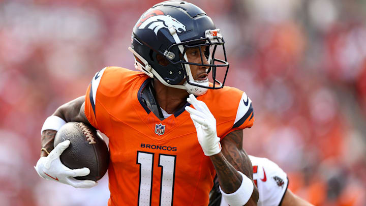 Sep 22, 2024; Tampa, Florida, USA; Denver Broncos wide receiver Josh Reynolds (11) makes a catch against the Tampa Bay Buccaneers in the first quarter at Raymond James Stadium. 