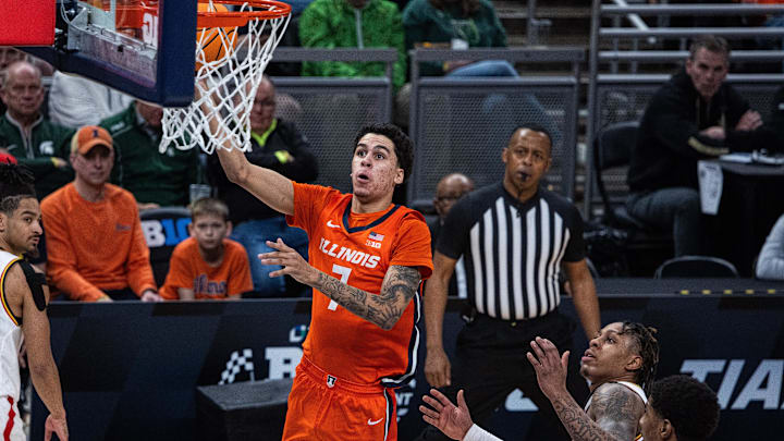 Mar 14, 2025; Indianapolis, IN, USA; Illinois Fighting Illini forward Will Riley (7) shoots the ball while Maryland Terrapins guard DeShawn Harris-Smith (5) defends in the first half  at Gainbridge Fieldhouse. Mandatory Credit: Trevor Ruszkowski-Imagn Images