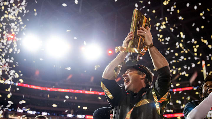 Jan 9, 2023; Inglewood, CA, USA; Georgia Bulldogs head coach Kirby Smart celebrates with the trophy after winning the CFP national championship game against the TCU Horned Frogs at SoFi Stadium. Mandatory Credit: Mark J. Rebilas-Imagn Images