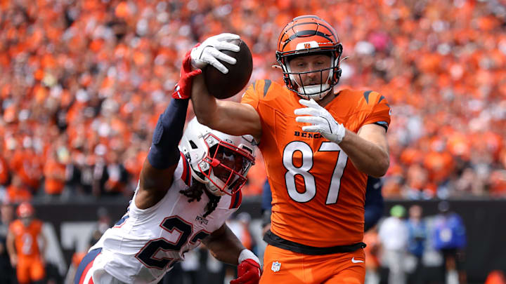 Sep 8, 2024; Cincinnati, Ohio, USA; Cincinnati Bengals tight end Tanner Hudson (87) runs to the end zone, but eventually fumbles the ball as New England Patriots safety Kyle Dugger (23) causes the turnover during the second quarter at Paycor Stadium. Mandatory Credit: Joseph Maiorana-Imagn Images Sep 8, 2024; Cincinnati, Ohio, USA; Cincinnati Bengals tight end Tanner Hudson (87) runs to the end zone, but eventually fumbles the ball as New England Patriots safety Kyle Dugger (23) causes the turnover during the second quarter at Paycor Stadium. Mandatory Credit: Joseph Maiorana-Imagn Images