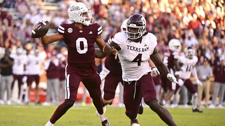 Oct 19, 2024; Starkville, Mississippi, USA;Mississippi State Bulldogs quarterback Michael Van Buren Jr. (0) drops back to pass against Texas A&M Aggies defensive lineman Shemar Stewart (4) during the third quarter at Davis Wade Stadium at Scott Field. Mandatory Credit: Matt Bush-Imagn Images